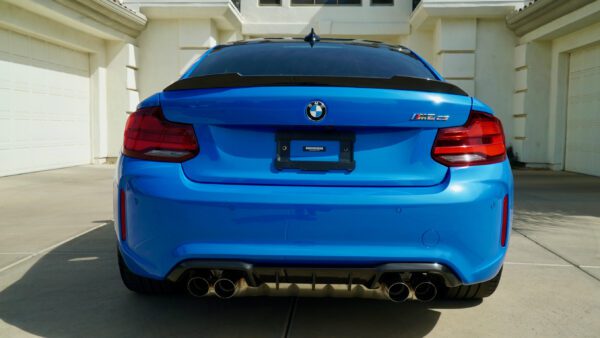 Back View of BMW Metallic Blue Car with logo