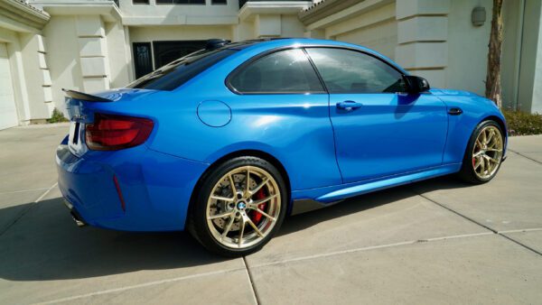 Side View of BMW blue car with wheels