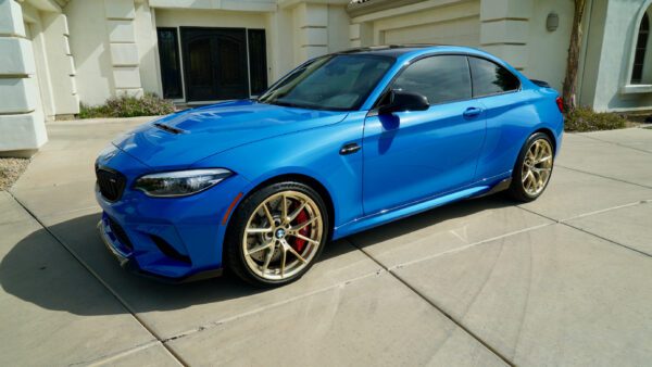 Side View of BMW blue Car with head light and wheels