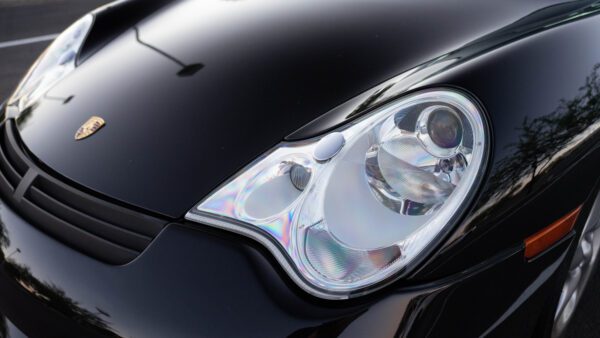 Front Head Light of Black Porsche