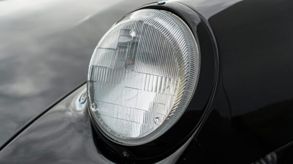 The headlight of a Porsche Vintage Car